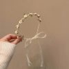 Gyöngyös hajpánt, krémszínű selyem rózsákkal, szatén szalaggal,  15 cm átmérőjű